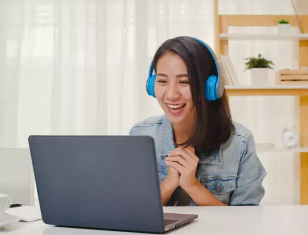 freelance-business-women-casual-wear-using-laptop-working-call-video-conference-with-customer-in-workplace-in-living-room-at-home-happy-young-asian-girl-relax-sitting-on-desk-do-job-in-internet