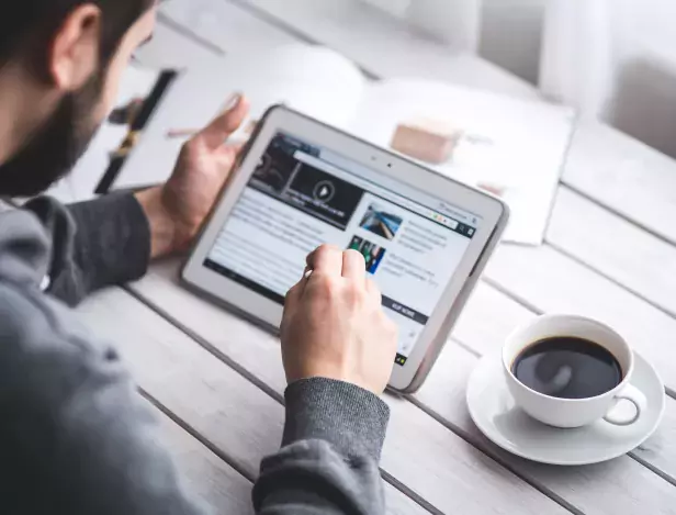 worker-reading-news-with-tablet